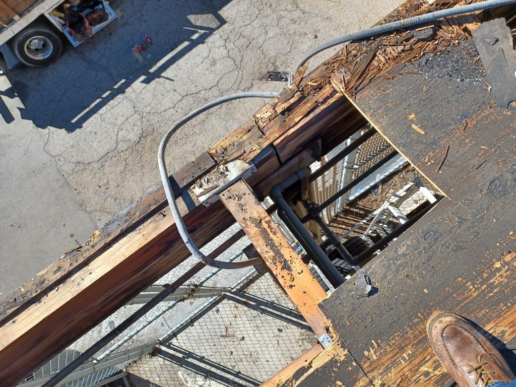 Mechanic building commercial roof repair